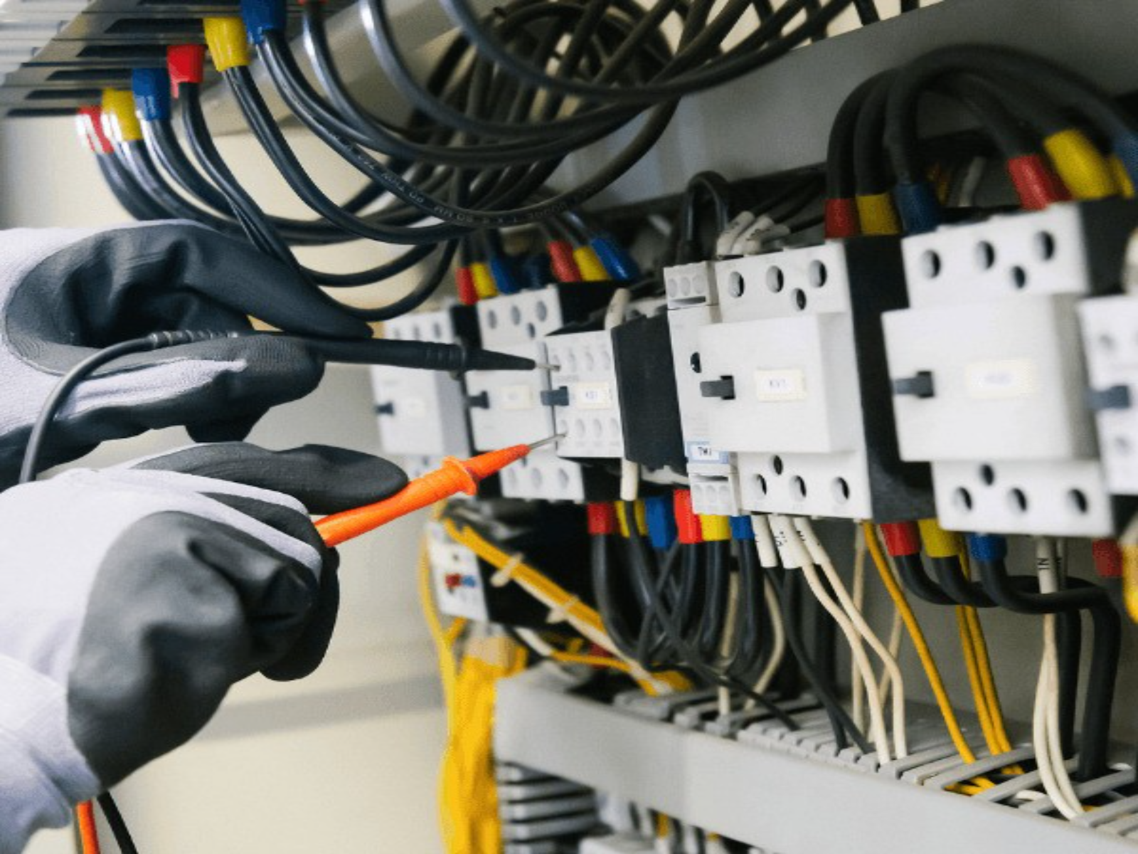 Electrician servicing a commercial panel